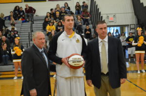 Sayre (Center) being honored before the game